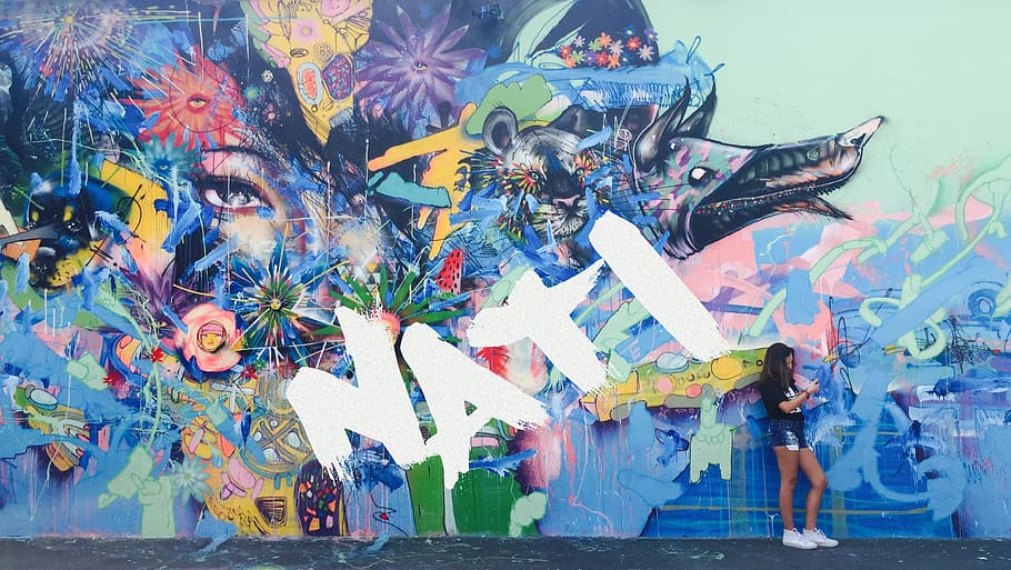 woman leaning against wall fulled with mural, woman leaning in multicolored art wall HD wallpaper
