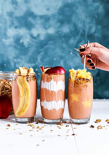 three clear drinking glass filled by shakes, three fruit shakes HD wallpaper