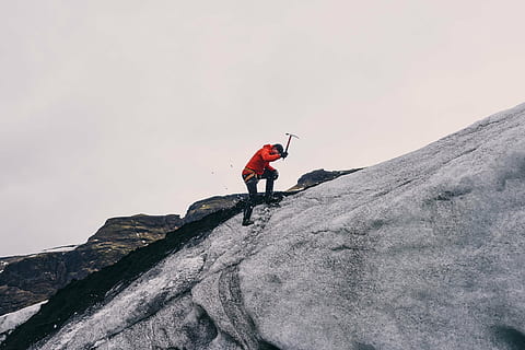 person standing on rock, orange, jacket, black, denim, jeans HD wallpaper
