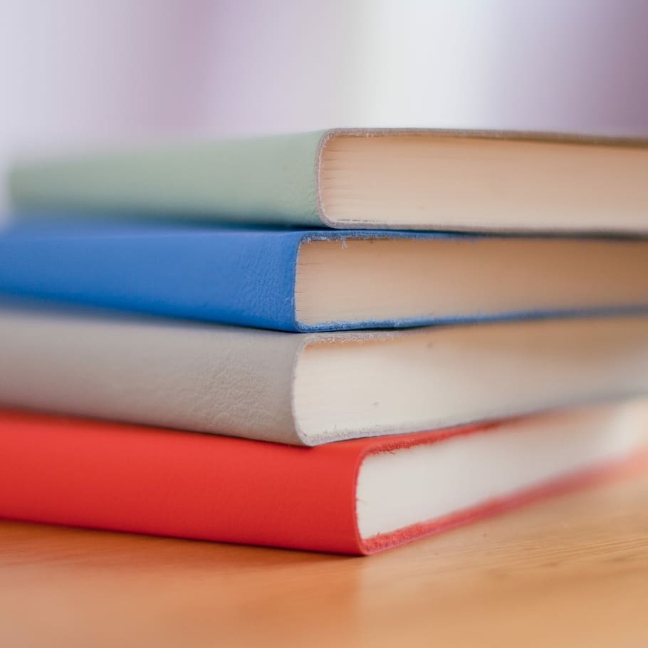 filed four books, four books stacked together in macro shot, journal HD wallpaper