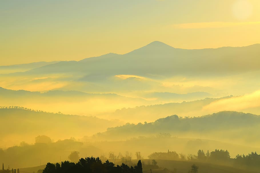 aerial view of trees, mountains and trees under yellow sky during daytime HD wallpaper