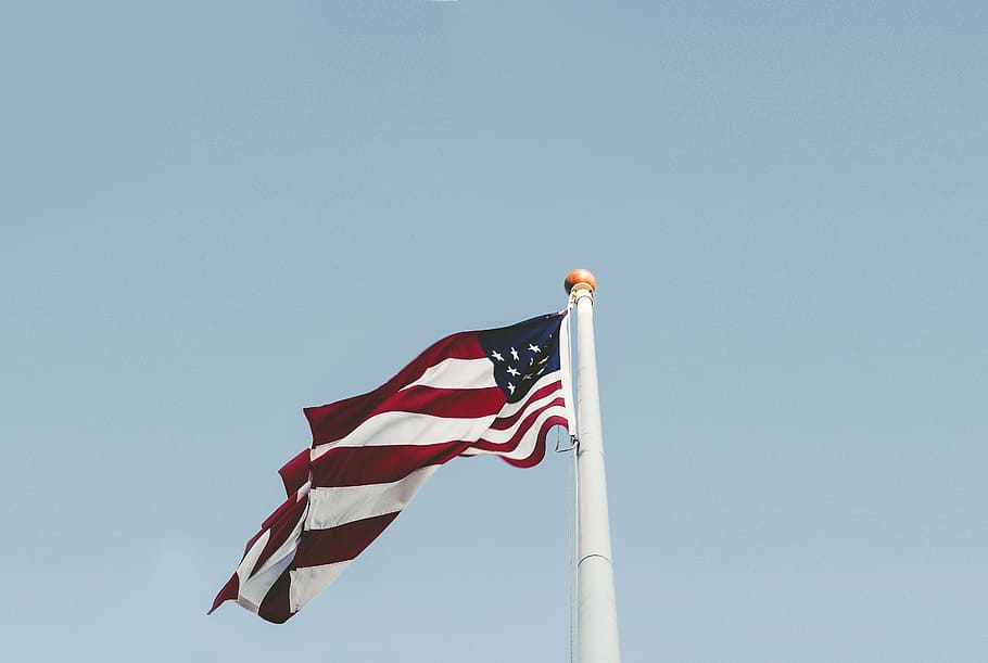 U.S.A flag under blue sky, worm's eye-view photography of USA flag
