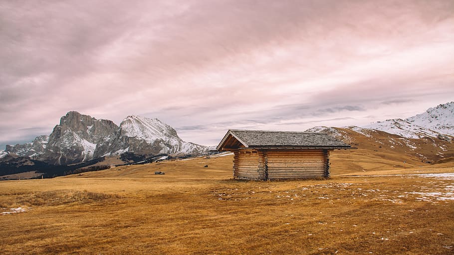 brown wooden house brown mountain surrounded by snow, brown wooden house in the middle of desert HD wallpaper