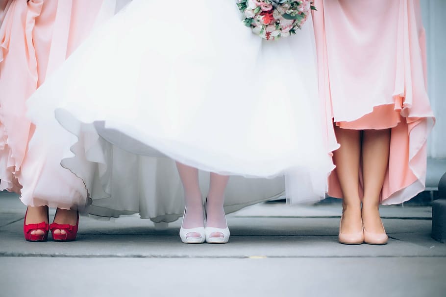 two woman wearing pink dress with woman wearing white dress, wedding
