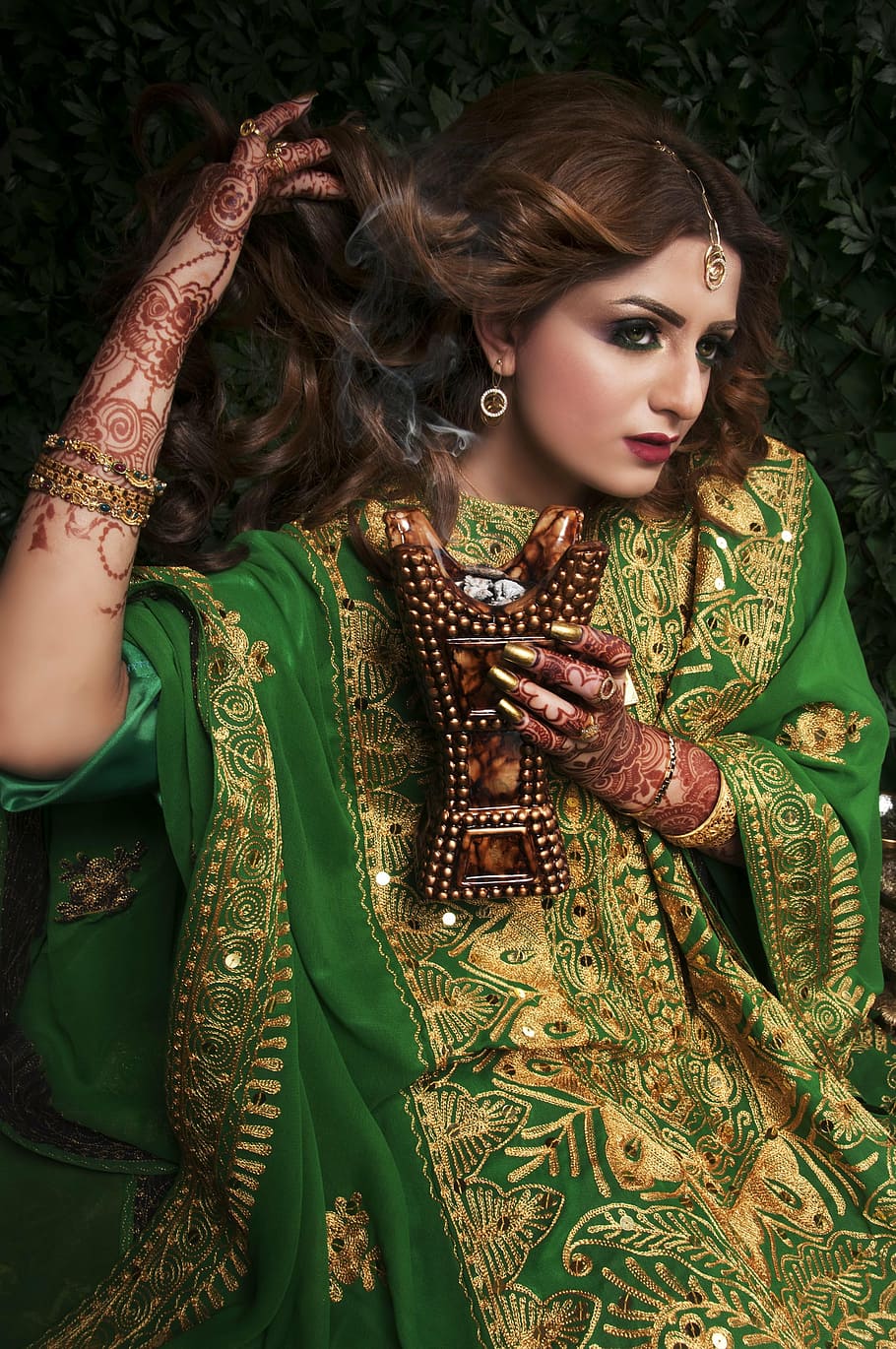 woman in green floral maxi dress, mehndi designs, henna, bride