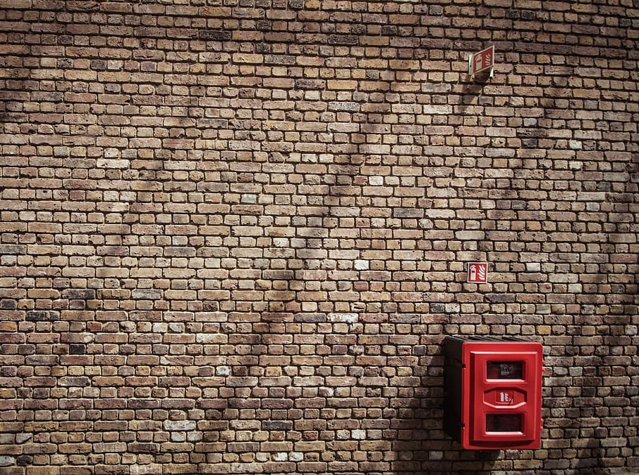 red metal case mounted on bricked wall, red box hang on brick walls HD wallpaper