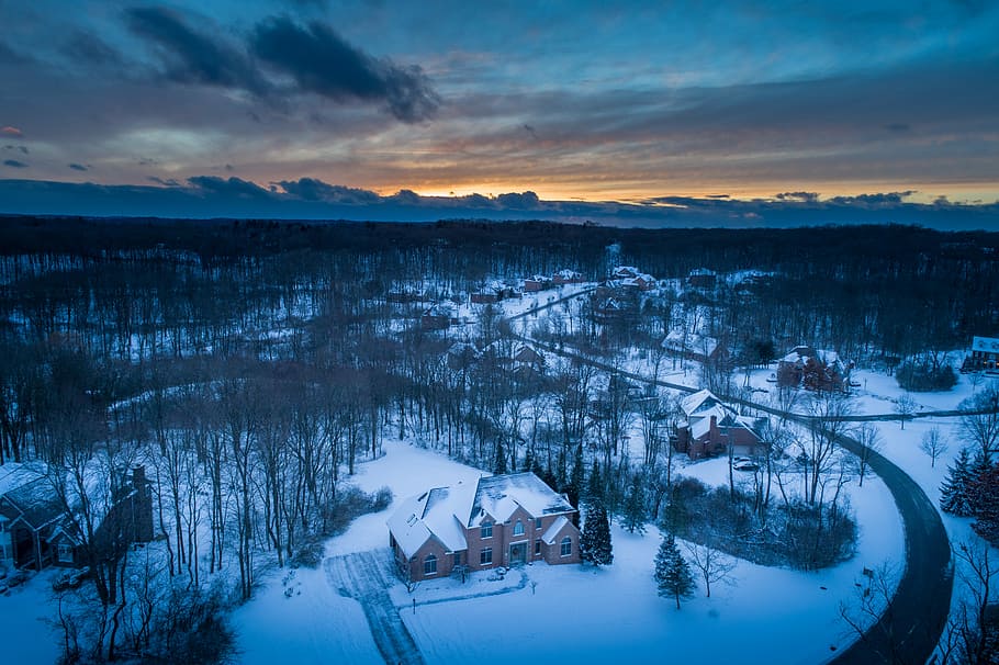 aerial photography of houses covered with snows, aerial photo of brown house in winter at golden hour HD wallpaper