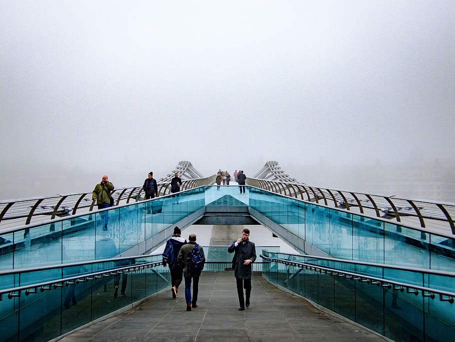 people walking near glass railings, people walking on blue and grey bridge HD wallpaper
