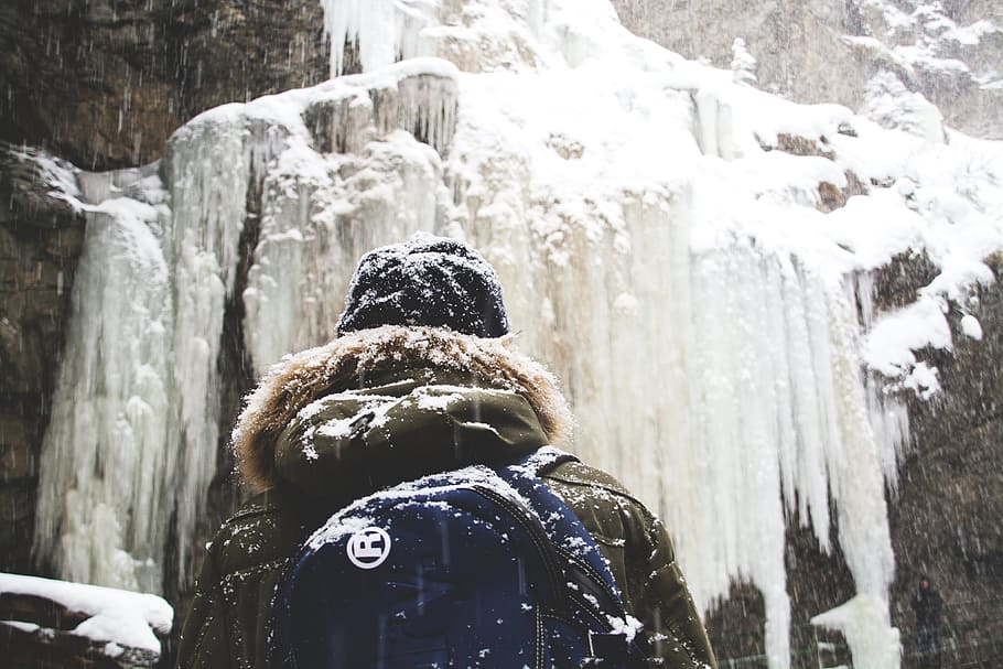 person in front of mountain, person in front of snow covered mountain HD wallpaper