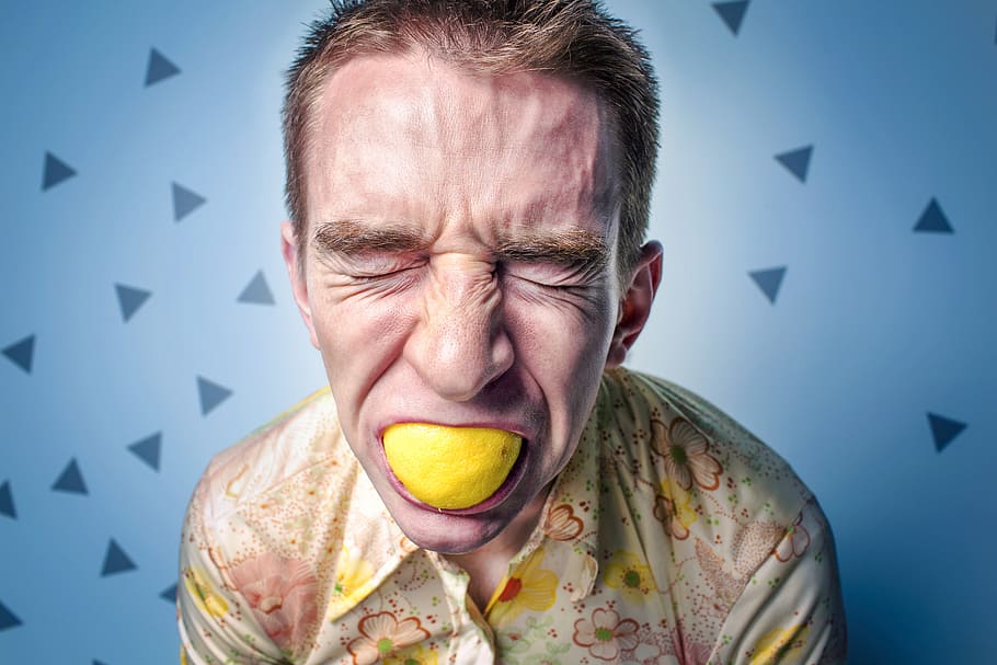 close up photography man eating lemon, stress, male, face, adult