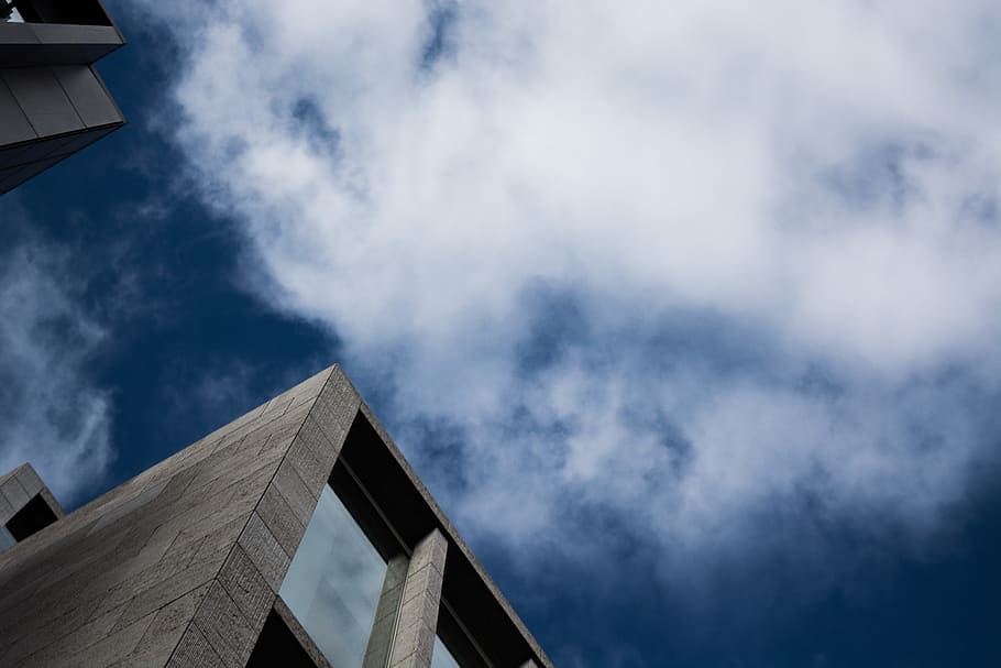 cloudy sky, low angle photography of building under white sky HD wallpaper