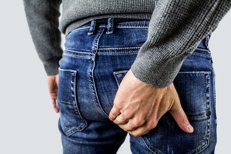 person holding back pocket, hemorrhoids, proctalgia fugax, prostate