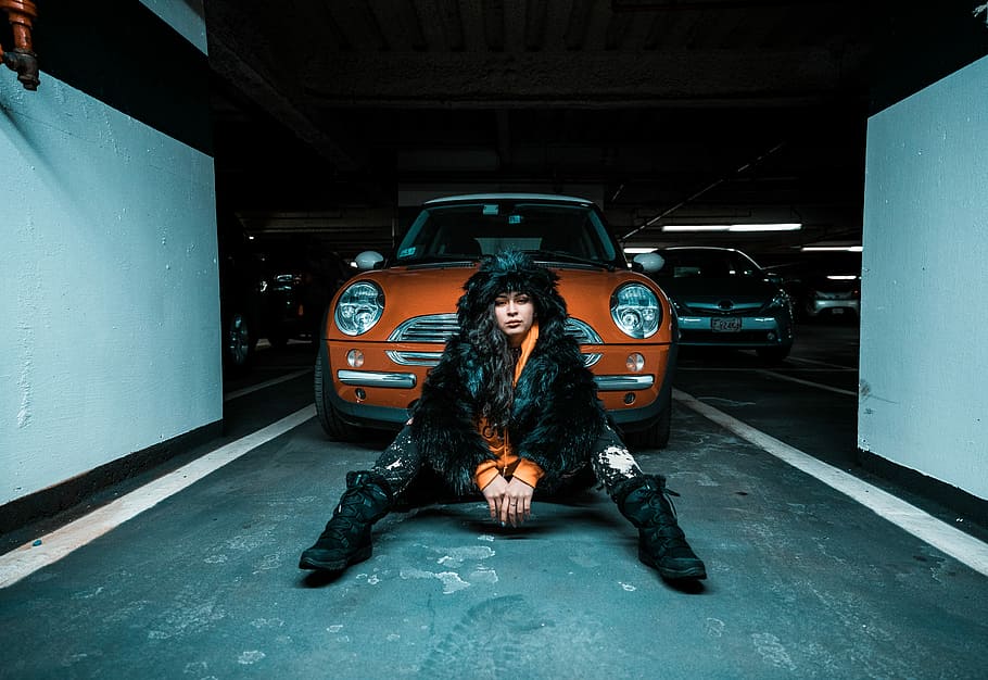 woman sitting on pavement near car, woman sitting in-front of Mini Cooper on parking lot HD wallpaper