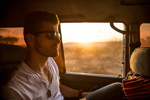man sitting on vehicle at golden hour, wearing, sunglasses HD wallpaper