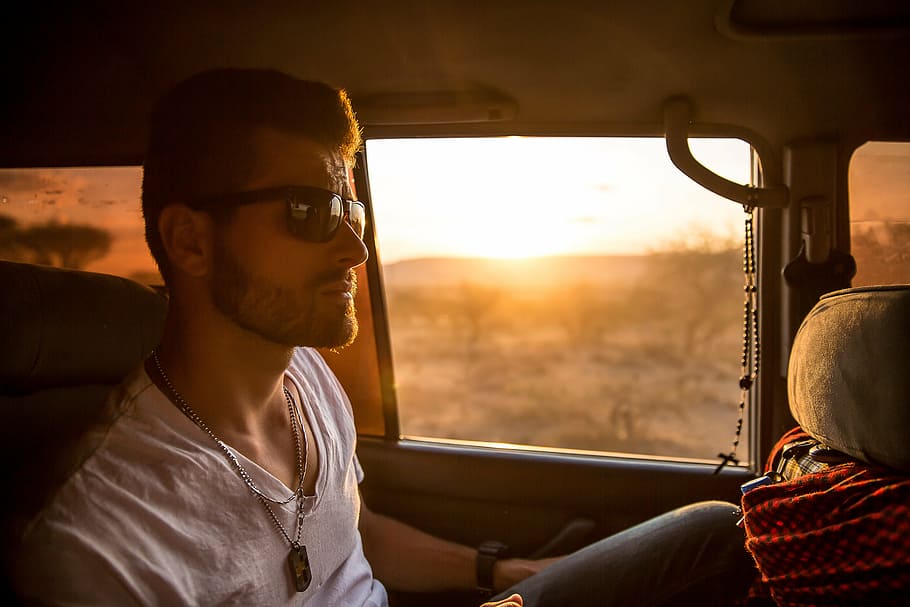 man sitting on vehicle at golden hour, wearing, sunglasses HD wallpaper