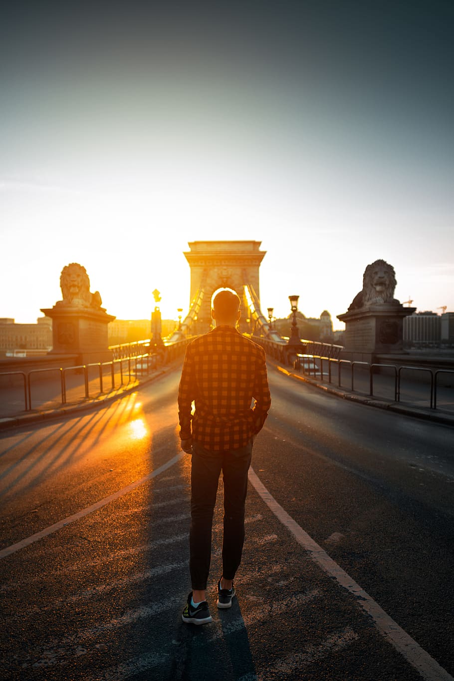 man walking pn bridhe, man in red and black plaid flannel shirt and black pants HD wallpaper