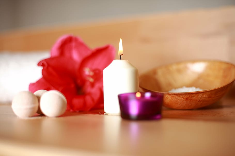 shallow photography of white candle on table, flower, sauna HD wallpaper