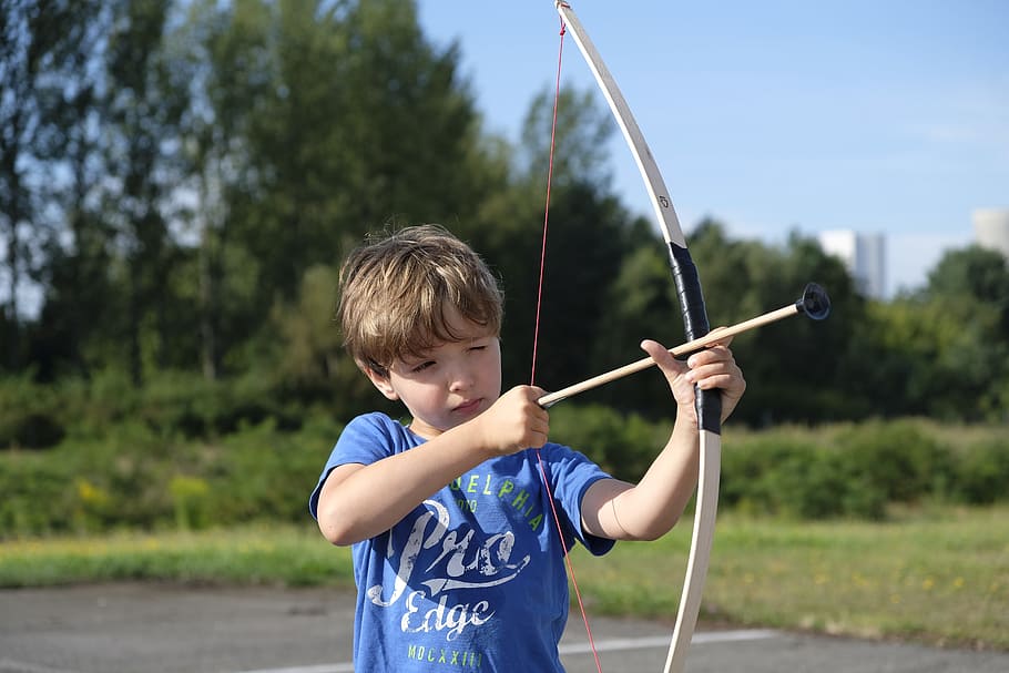 boy holding beige bow and arrow toy, child, arch, archery, shoot, HD wallpaper