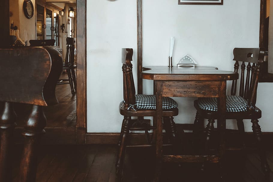 brown wooden 3-piece bistro set near white wall inside room, wooden table and chairs inside the room HD wallpaper