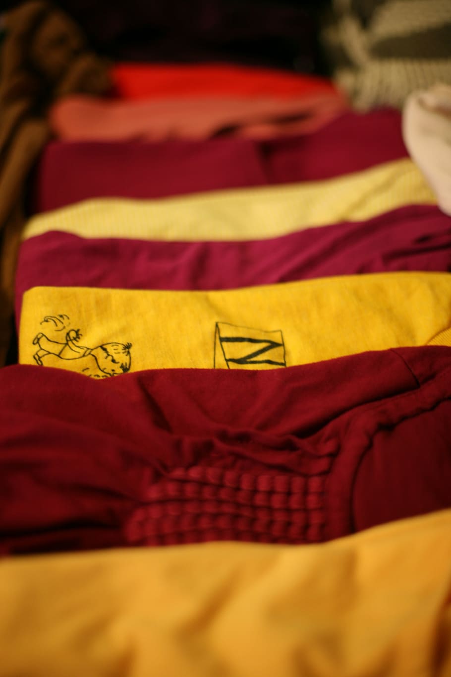 several assorted-color shirts on brown surface, laundry, t-shirt HD wallpaper