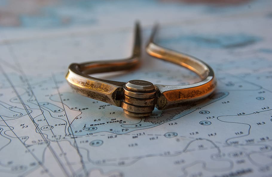gold-colored metal tool in closeup photography, marine map HD wallpaper