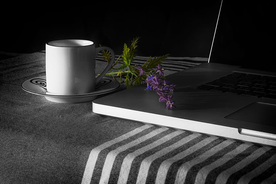 white ceramic mug on saucer beside black laptop, mac, apple HD wallpaper