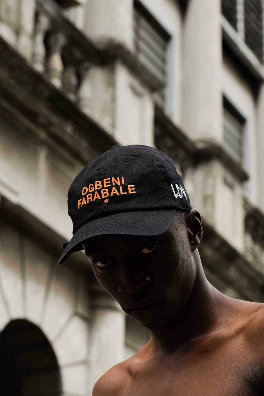 selective focus photography of man wearing cap, man staring at the camera HD wallpaper