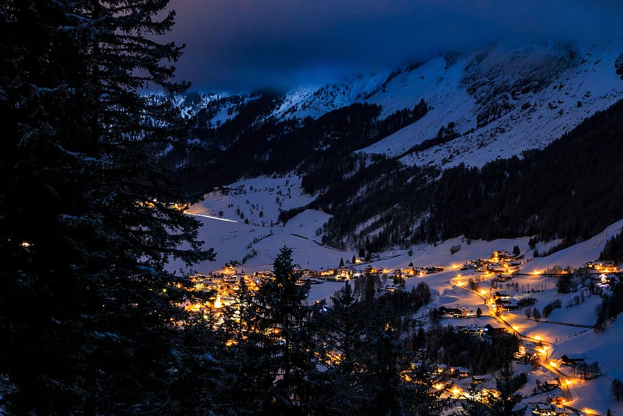 snow field houses near trees, photo of trees and mountain at nighttime HD wallpaper