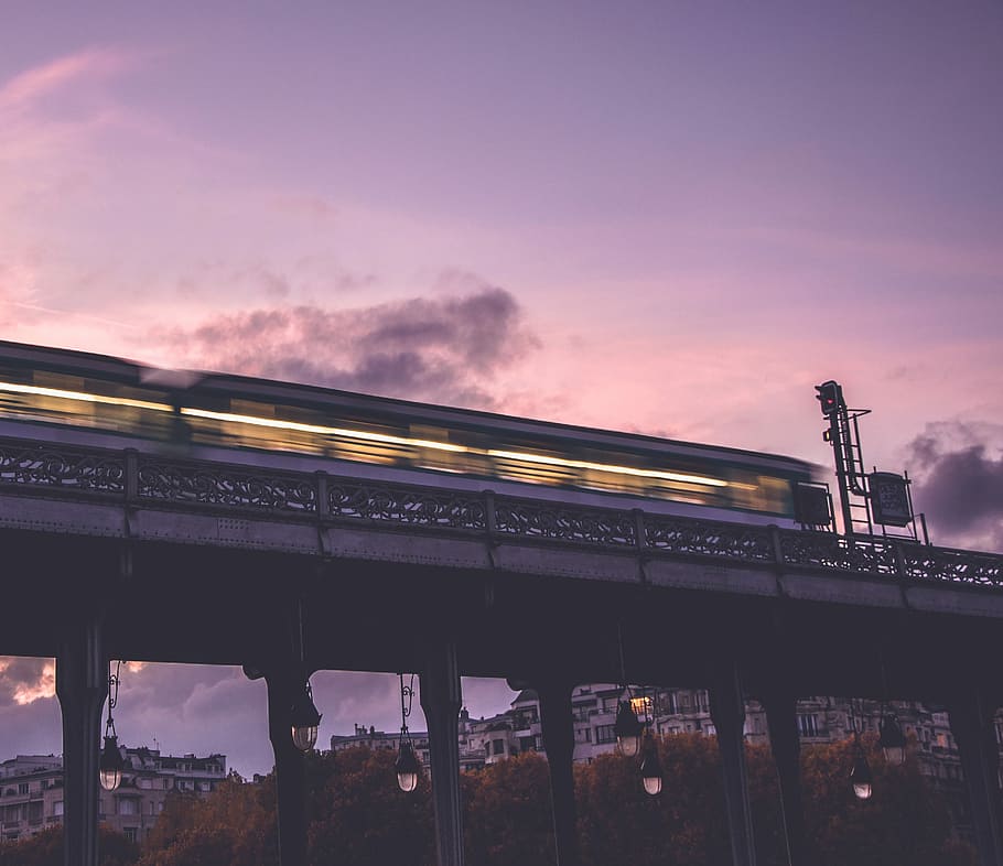 worm's eye view photography of train, timelapse photo of bullet train during sunset HD wallpaper