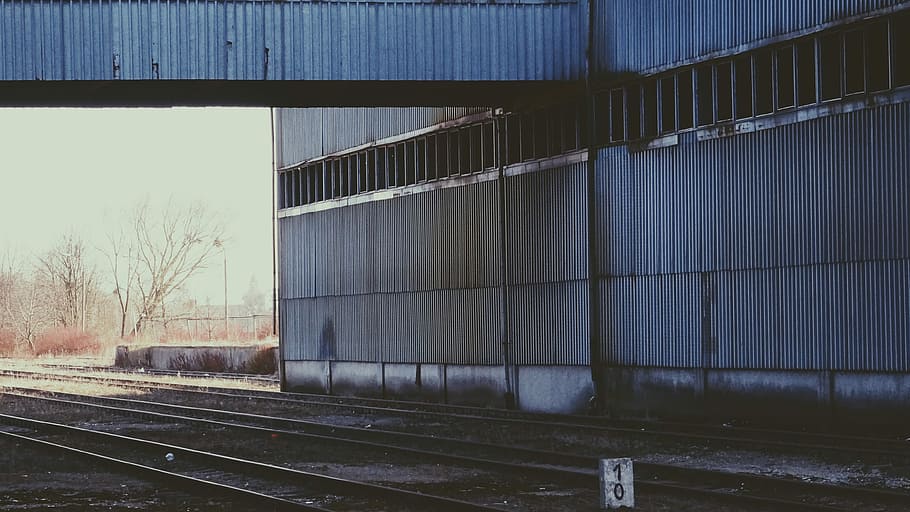 grey metal building, gray metal building at daytime, railway HD wallpaper