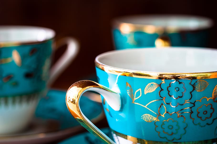 selective focus photography of gold and blue floral mug and saucer HD wallpaper