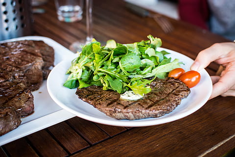 Barbequed beef steak with greens, grilling, hands, meat, food HD wallpaper