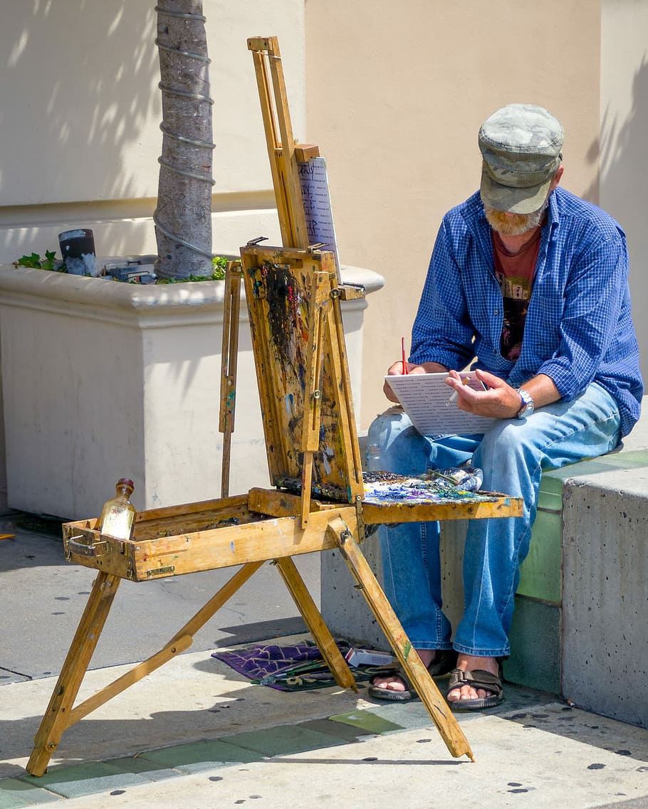man painting, man writing on book, artist, painter, easel, sitting, HD wallpaper