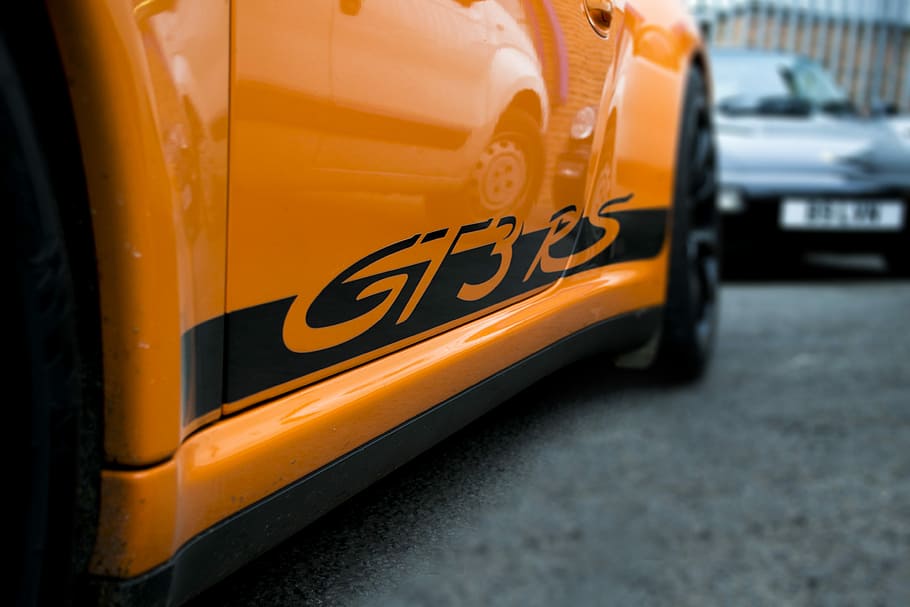 orange car on gray concrete floor, racing, race, track, fast HD wallpaper