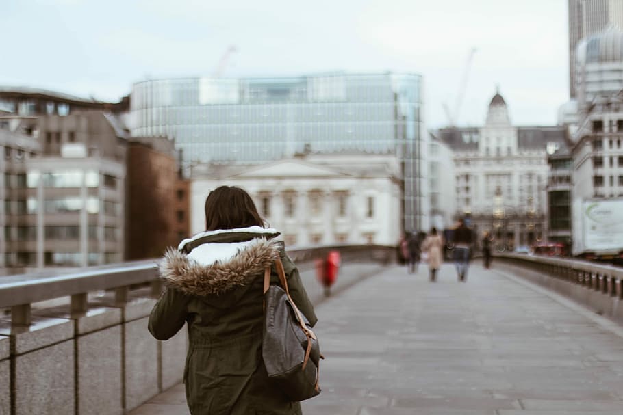 shallow focus photography of woman in green coat, woman walking on road HD wallpaper