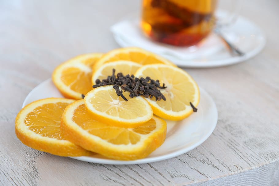 sliced lemon fruits filled white plate, saucer, citrus, oranges HD wallpaper