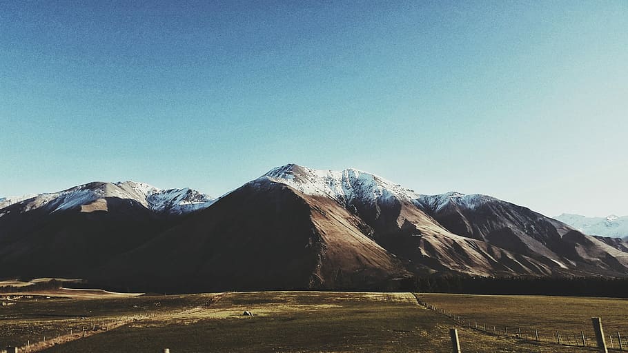 photo of mountain and green field, snow covered mountain during daytime HD wallpaper