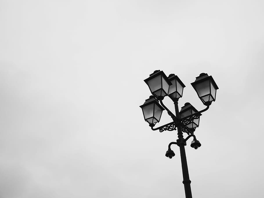 grayscale photography of 5-light outdoor post lamp, lantern, street light