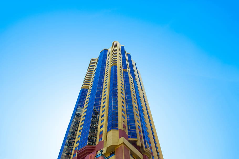blue and beige high-rise building, low angle photo of beige and blue high-rise building under blue sky at daytime, HD wallpaper