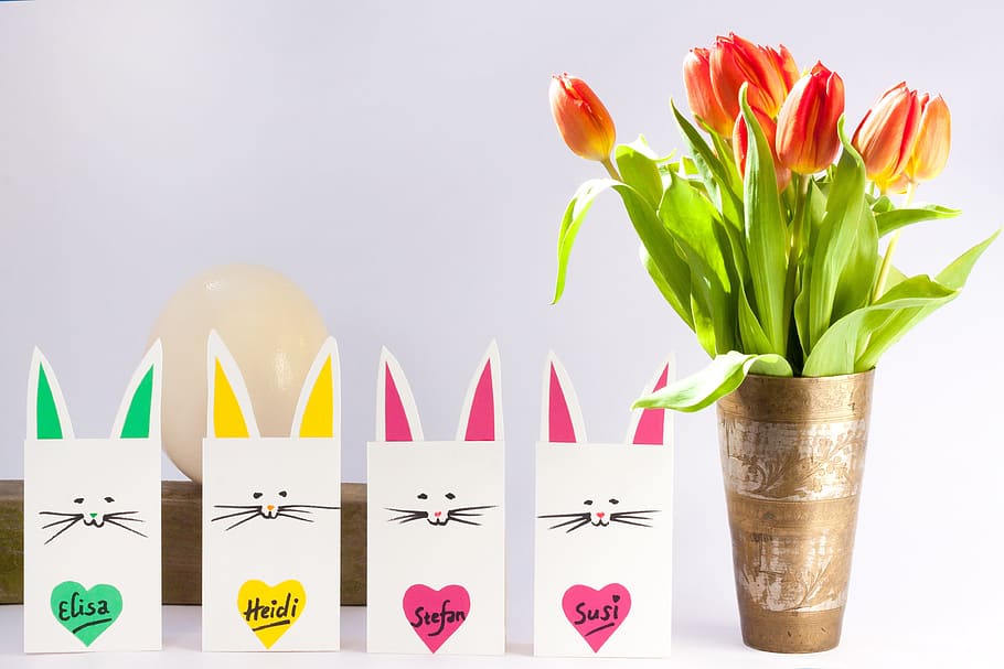 orange and yellow Tulip flowers on vase beside four cats paper bags HD wallpaper