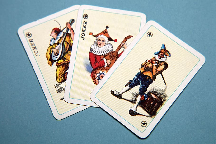 three joker playing cards place on teal surface, luck, gambling, HD wallpaper