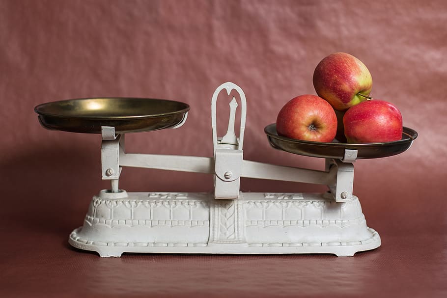 white steel balancing scale, horizontal, apple, weight control