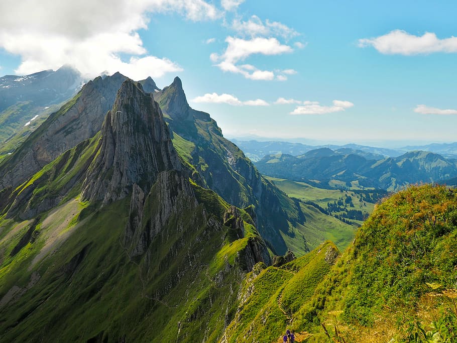 green and gray high raised mountain under cumulos clouds during daytime HD wallpaper