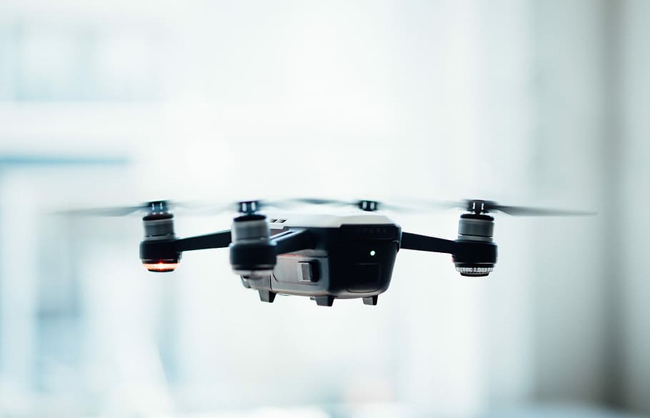 black quadcopter drone selective focus photograph, focus photo of black drone HD wallpaper