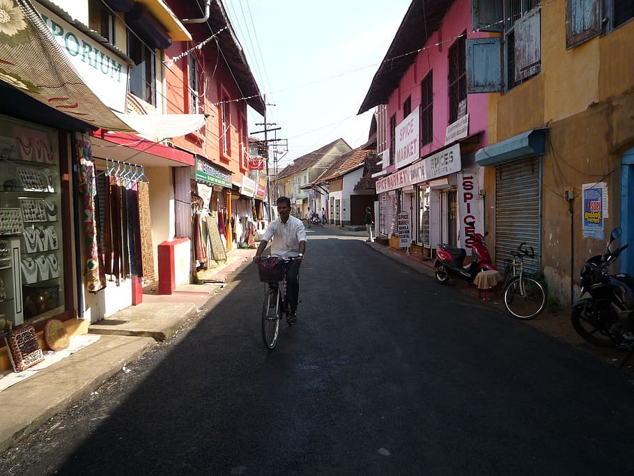 man riding on bicycle at daytime, cochin, kochi, india, kerala