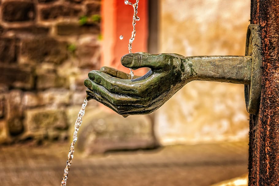 selective focus photography of begging hand bust, fountain HD wallpaper
