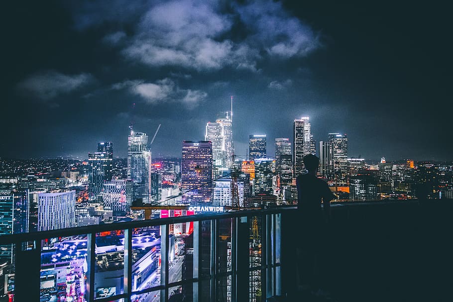silhouette of man looking somewhere, silhouette of man looking at high rise buildings HD wallpaper