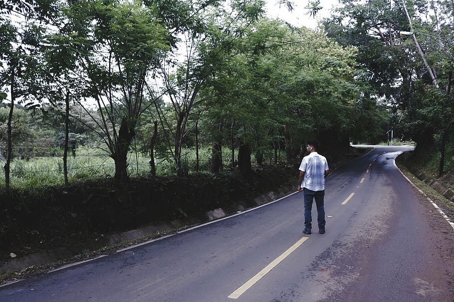man in white shirt and black bottoms standing on road, wearing HD wallpaper