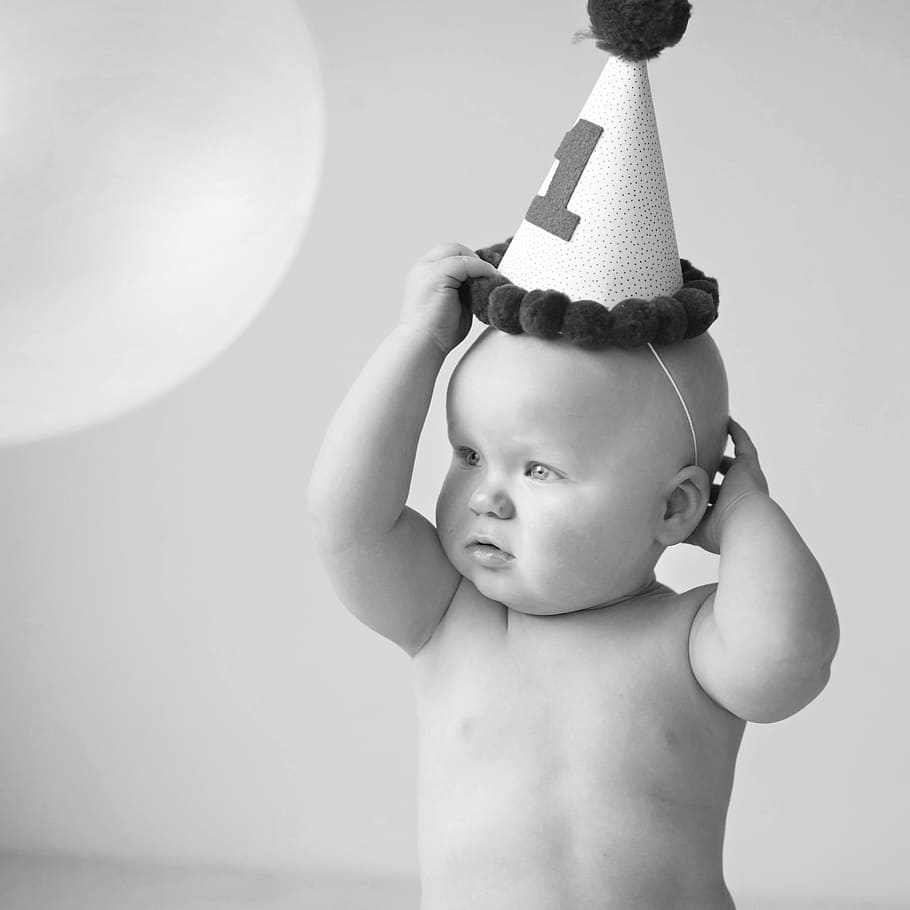 grayscale photo of baby wearing party hat, boy, birthday, child