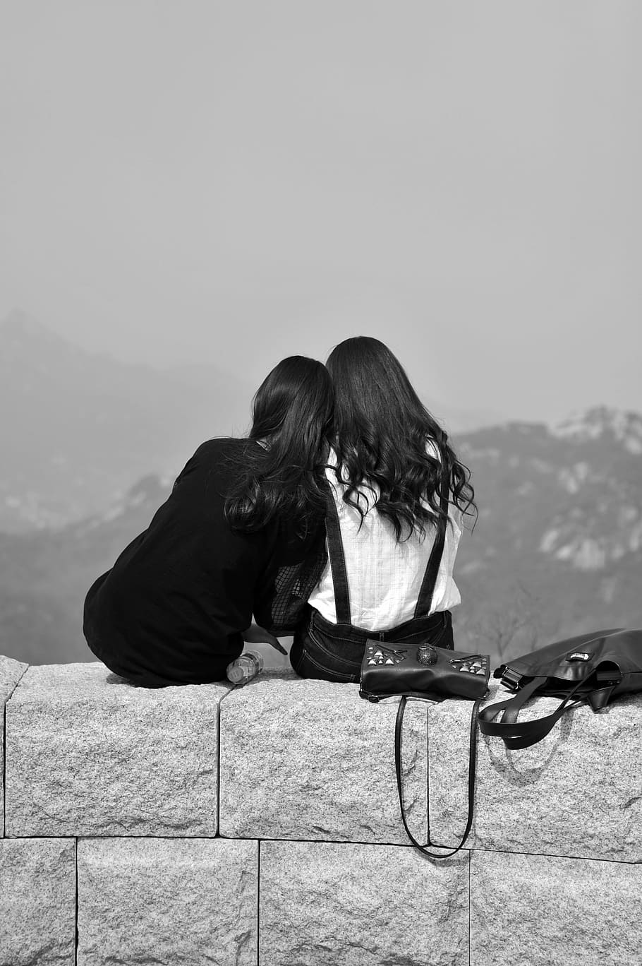HD wallpaper: grayscale photo of two women sitting on cinder block wall,  friends | Wallpaper Flare